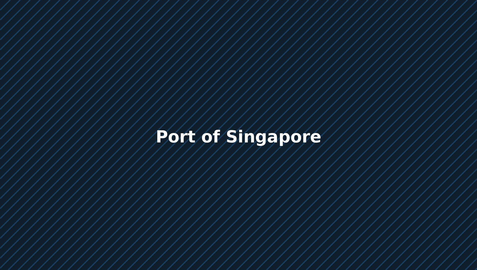 Container terminal at the Port of Singapore at dusk with gantry cranes loading a cargo vessel